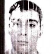 Низькоякісне чорно-біле портретне зображення чоловіка - Бич Валентин Юрійович, що нагадує фото з документів.