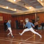 Михайло Жлуктенко в юні роки на змаганнях з фехтування